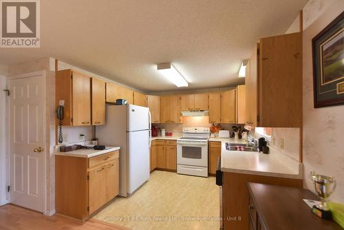 56 Tecumseth Pines Drive, New Tecumseth, ON - Indoor Photo Showing Kitchen With Double Sink