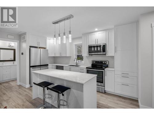 Carriage home kitchen upstairs - 1400-1404 Braemar Street, Kelowna, BC - Indoor Photo Showing Kitchen With Upgraded Kitchen