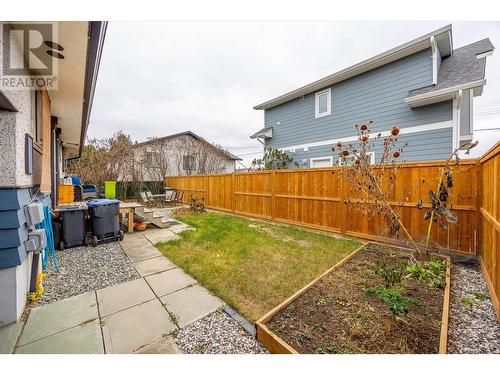 Privacy fence between the main home and carriage home - 1400-1404 Braemar Street, Kelowna, BC - Outdoor