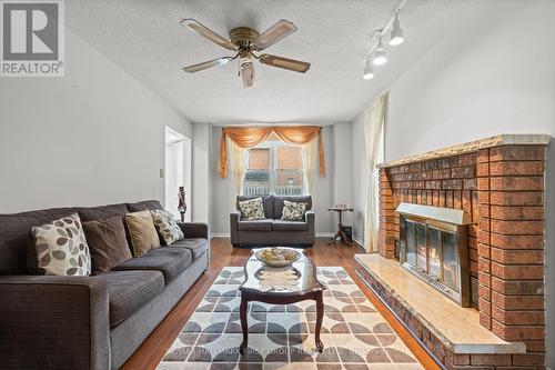 18 Intrepid Drive, Whitby, ON - Indoor Photo Showing Living Room With Fireplace