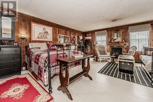 1303 Maryhill Road E, Woolwich, ON - Indoor Photo Showing Bedroom With Fireplace