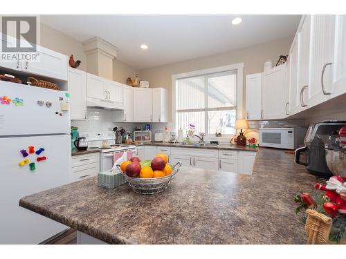 8804 17 Street, Dawson Creek, BC - Indoor Photo Showing Kitchen With Double Sink