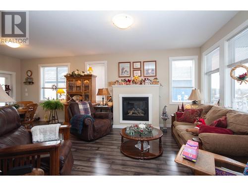 8804 17 Street, Dawson Creek, BC - Indoor Photo Showing Living Room With Fireplace