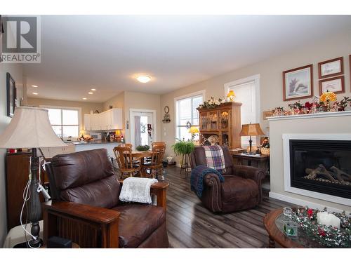 8804 17 Street, Dawson Creek, BC - Indoor Photo Showing Living Room With Fireplace