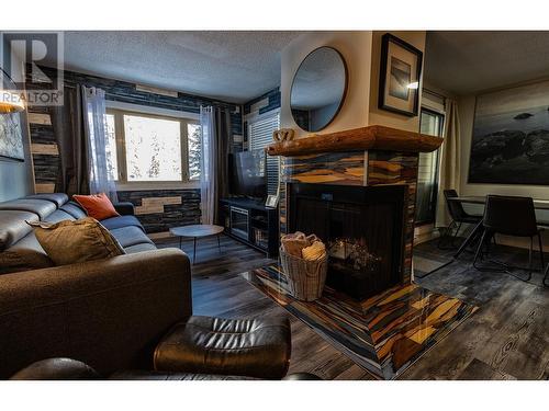 2035 Panorama Drive Unit# 202, Panorama, BC - Indoor Photo Showing Living Room With Fireplace