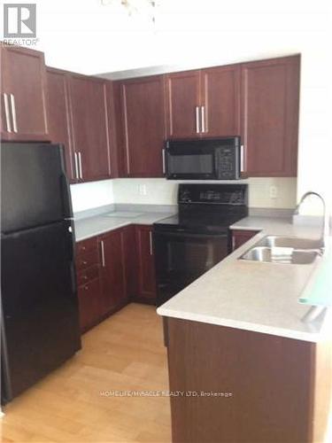 310 - 3939 Duke Of York Boulevard, Mississauga, ON - Indoor Photo Showing Kitchen With Double Sink