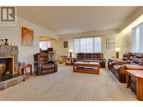 8272 St John Crescent, Prince George, BC - Indoor Photo Showing Living Room With Fireplace