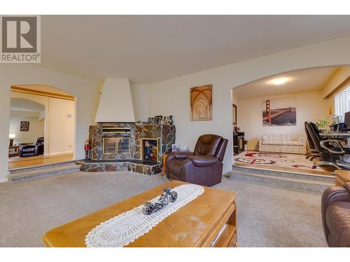 8272 St John Crescent, Prince George, BC - Indoor Photo Showing Living Room With Fireplace