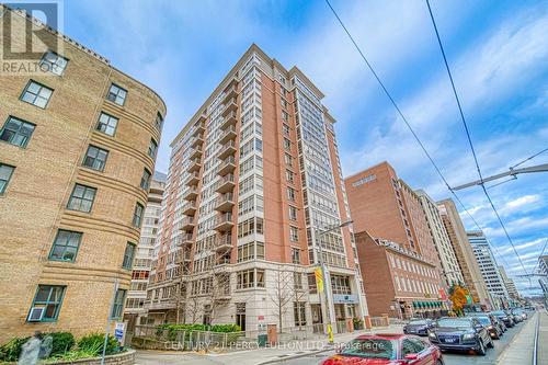 906 - 60 St Clair Avenue W, Toronto, ON - Outdoor With Facade