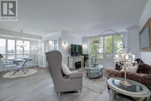 213 - 1000 The Esplanade N, Pickering, ON - Indoor Photo Showing Living Room With Fireplace