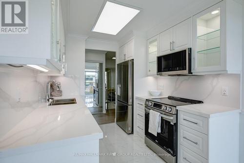 213 - 1000 The Esplanade N, Pickering, ON - Indoor Photo Showing Kitchen With Stainless Steel Kitchen With Double Sink With Upgraded Kitchen