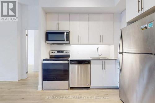 421 - 3220 Sheppard Avenue E, Toronto, ON - Indoor Photo Showing Kitchen With Stainless Steel Kitchen With Double Sink