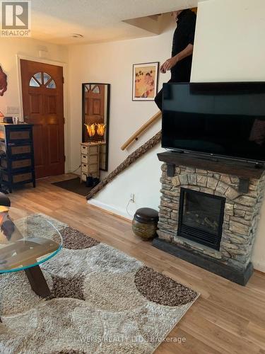 3 Khedive Avenue, Toronto, ON - Indoor Photo Showing Living Room With Fireplace