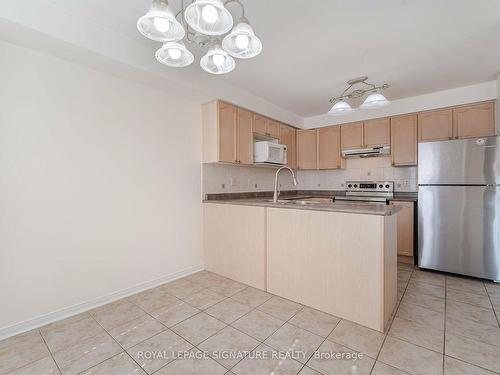 113-5530 Glen Erin Dr, Mississauga, ON - Indoor Photo Showing Kitchen With Double Sink