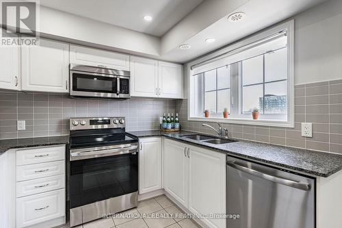 124 - 2441 Greenwich Drive, Oakville, ON - Indoor Photo Showing Kitchen With Double Sink