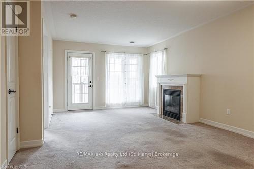 7 - 20 Huron Street N, St. Marys, ON - Indoor Photo Showing Living Room With Fireplace