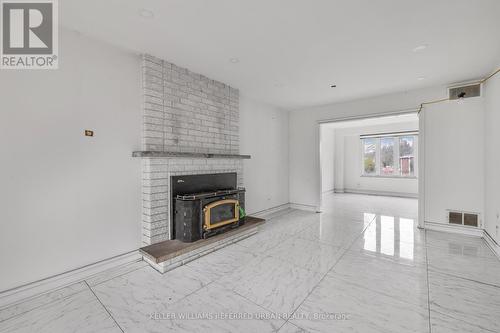 135 Natanya Boulevard, Georgina, ON - Indoor Photo Showing Living Room With Fireplace