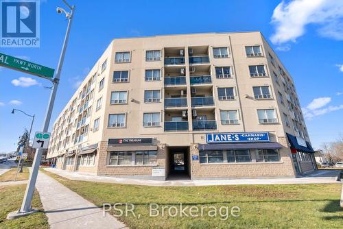 303 - 160 Wellington Street E, Aurora, ON - Outdoor With Balcony With Facade