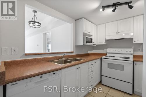 303 - 160 Wellington Street E, Aurora, ON - Indoor Photo Showing Kitchen With Double Sink