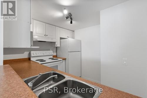 303 - 160 Wellington Street E, Aurora, ON - Indoor Photo Showing Kitchen With Double Sink