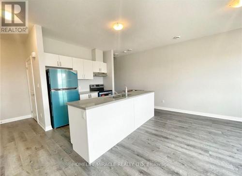 6705 Cropp Street, Niagara Falls, ON - Indoor Photo Showing Kitchen With Double Sink