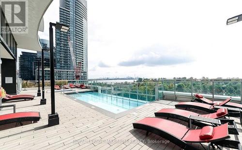 702 - 33 Shore Breeze Drive, Toronto, ON - Outdoor With In Ground Pool