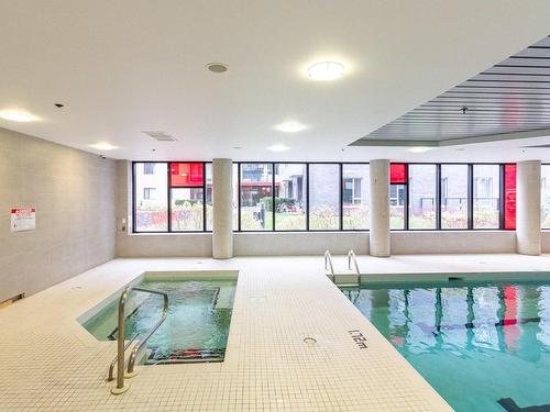 Piscine - 313-4239 Rue Jean-Talon O., Montréal (Côte-Des-Neiges/Notre-Dame-De-Grâce), QC - Indoor Photo Showing Other Room With In Ground Pool