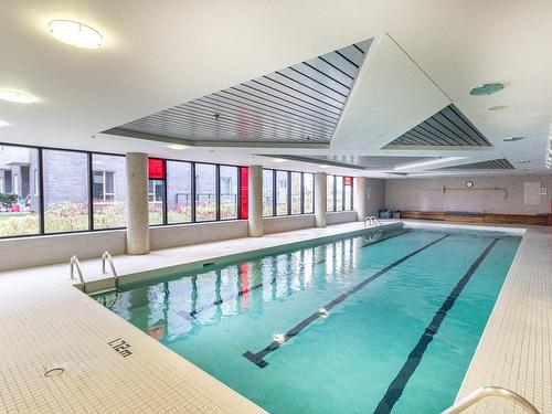 Piscine - 313-4239 Rue Jean-Talon O., Montréal (Côte-Des-Neiges/Notre-Dame-De-Grâce), QC - Indoor Photo Showing Other Room With In Ground Pool