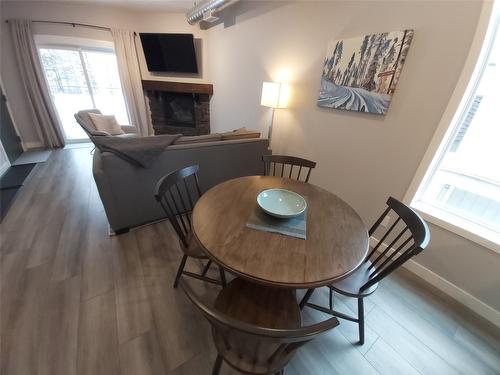 425-1151 Gerry Sorensen Way, Kimberley, BC - Indoor Photo Showing Dining Room With Fireplace