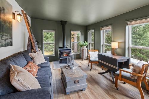 6931 Customs Road, Kingsgate, BC - Indoor Photo Showing Living Room With Fireplace