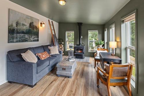 6931 Customs Road, Kingsgate, BC - Indoor Photo Showing Living Room With Fireplace