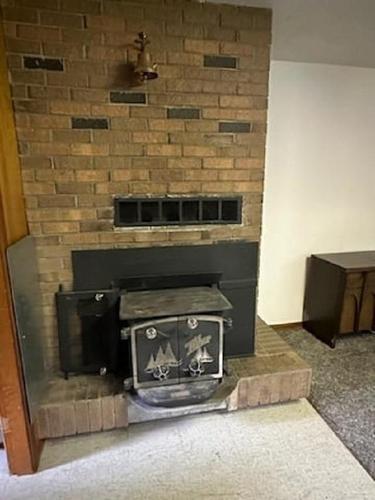 217 6Th Street, Nakusp, BC - Indoor Photo Showing Other Room With Fireplace