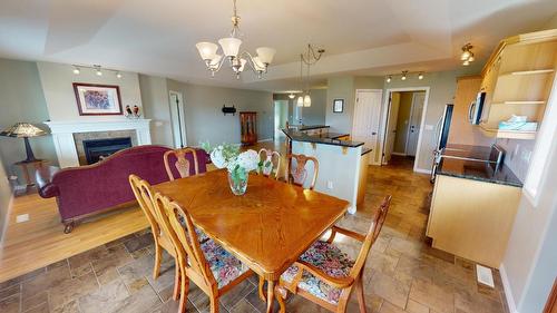 27-1401 30Th  N Avenue, Cranbrook, BC - Indoor Photo Showing Dining Room With Fireplace