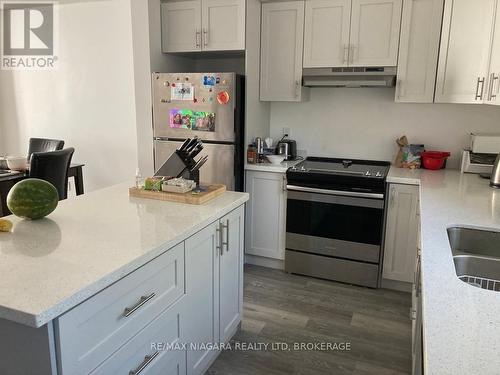 7 Upper - 8196 Mcleod Road, Niagara Falls (222 - Brown), ON - Indoor Photo Showing Kitchen With Double Sink