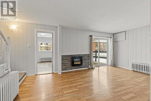 92 Empire Street, Welland (773 - Lincoln/Crowland), ON - Indoor Photo Showing Living Room With Fireplace