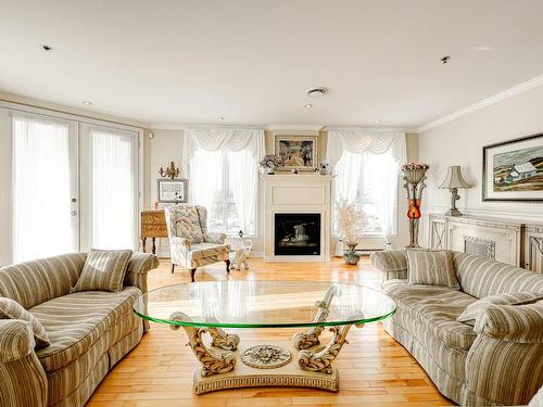 Salon - 407-3100 Boul. Notre-Dame, Laval (Chomedey), QC - Indoor Photo Showing Living Room With Fireplace