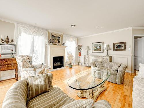 Salon - 407-3100 Boul. Notre-Dame, Laval (Chomedey), QC - Indoor Photo Showing Living Room With Fireplace