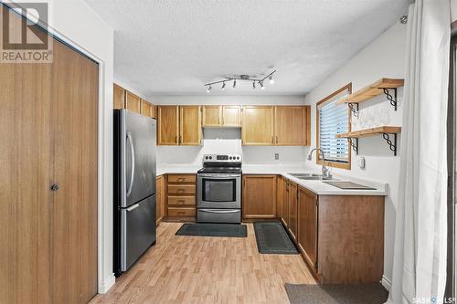 146 Weyakwin Drive, Saskatoon, SK - Indoor Photo Showing Kitchen With Double Sink