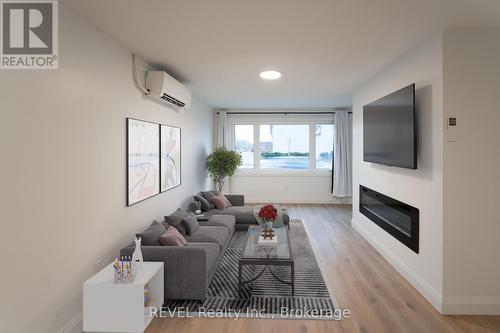 1 - 718 Ontario Road, Welland (773 - Lincoln/Crowland), ON - Indoor Photo Showing Living Room With Fireplace