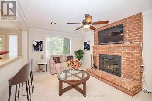 24 Bascary Crescent, St. Catharines (462 - Rykert/Vansickle), ON - Indoor Photo Showing Living Room With Fireplace