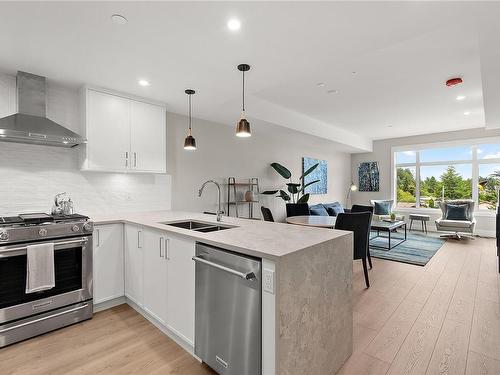 201-2520 Hackett Cres, Central Saanich, BC - Indoor Photo Showing Kitchen With Stainless Steel Kitchen With Double Sink With Upgraded Kitchen