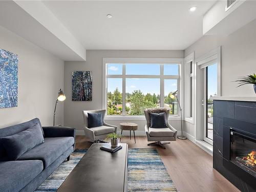 201-2520 Hackett Cres, Central Saanich, BC - Indoor Photo Showing Living Room With Fireplace