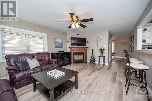 259 3 Mile, Lanark Highlands, ON - Indoor Photo Showing Living Room With Fireplace