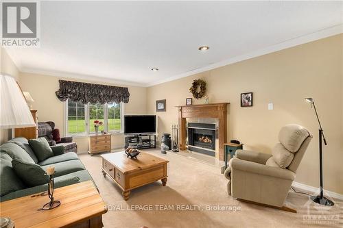 3200 County 31 Road, North Dundas, ON - Indoor Photo Showing Living Room With Fireplace