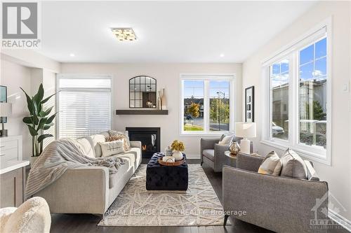 500 Escapade, Ottawa, ON - Indoor Photo Showing Living Room With Fireplace