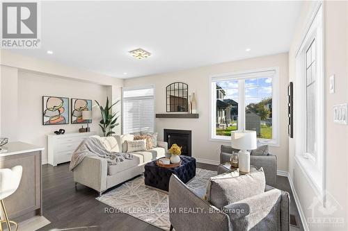 500 Escapade, Ottawa, ON - Indoor Photo Showing Living Room With Fireplace