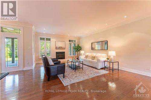 5422 Wadell Court, Ottawa, ON - Indoor Photo Showing Living Room With Fireplace