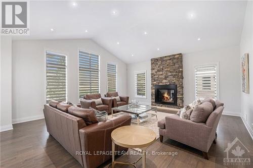 212 Cabrelle Place, Ottawa, ON - Indoor Photo Showing Living Room With Fireplace