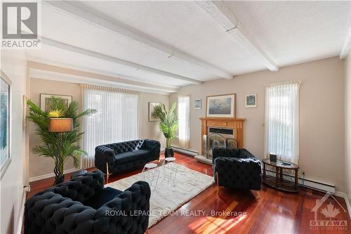 25 Saginaw Crescent, Ottawa, ON - Indoor Photo Showing Living Room With Fireplace