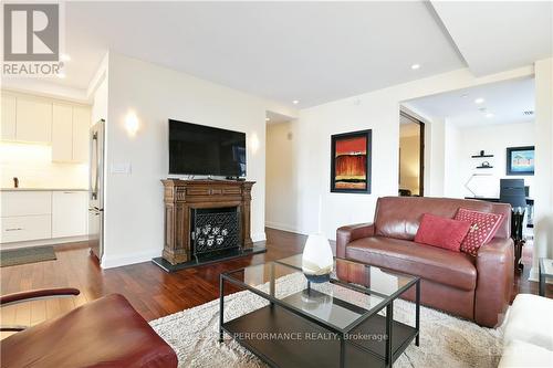 207 - 111 Champagne Avenue, Ottawa, ON - Indoor Photo Showing Living Room With Fireplace